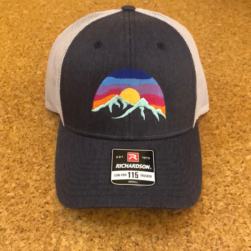 Brand new Richardson trucker hat with embroidered mountains